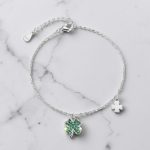 Silver bracelet with green stone clover charm