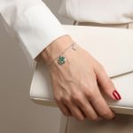 Silver bracelet with green stone clover charm