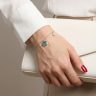 Silver bracelet with green stone clover charm
