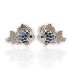Silver fish earrings with blue stones