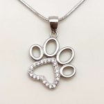 Silver pendant with sparkling paw print