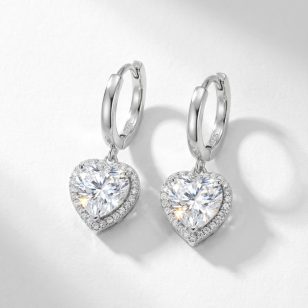 Silver hoop earrings with sparkling zirconia hearts