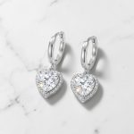 Silver hoop earrings with sparkling zirconia hearts