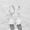 Silver hoop earrings with elegant pearl pendants