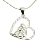 Silver heart pendant: dog and owner