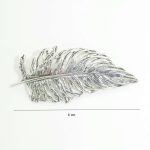Windblown feather antique silver brooch