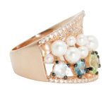 Silver cocktail ring in rose gold color with white pearls and colored stones 