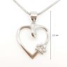 Silver heart pendant with animal motif