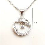 Silver pendant with sun, moon, and stars
