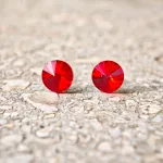 Hypoallergenic silicone earrings with red zirconia stone