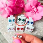 Hypoallergenic silicone earrings with green zirconia stone