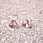 Hypoallergenic silicone heart earrings with pink zirconia stone