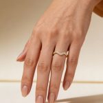 Stackable gold wave ring with zirconia stones