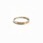 Gold wedding band with 11 diamond stones