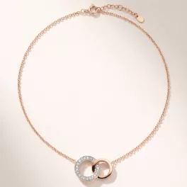   Rose gold pendant necklace with diamond-encrusted loop pendant