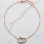 Rose gold pendant necklace with diamond-encrusted loop pendant