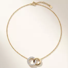 Gold pendant necklace with diamond-encrusted loop pendant